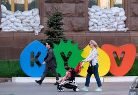 People pass near the Kyiv City State Administration