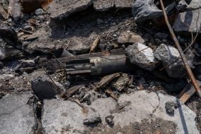 Tank fragmentation and high-explosive projectile at the destroyed base of the Russian occupiers in the village of Biscuitne
