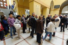 People are standing in line near the Main Post Office of Lviv