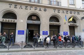 People are standing in line near the Main Post Office of Lviv