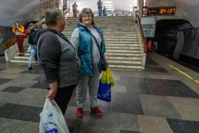 Passengers are waiting for the train at the metro station "Central Market"