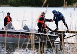 Rescuers hand over shells found during Blue Lake demining in Gorenka village
