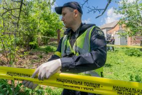 Experts are conducting investigative actions during the exhumation of the body of a murdered resident of the village of Koropove