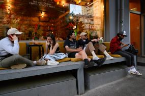 Young people near one of the cafe