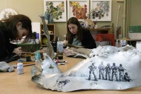 Artists paint fragments of shot down rockets