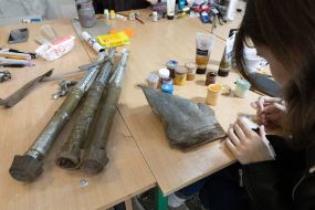 Artists paint fragments of shot down rockets