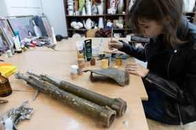 Artists paint fragments of shot down rockets