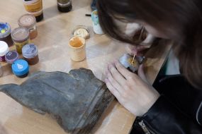 Artists paint fragments of shot down rockets