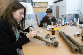 Artists paint fragments of shot down rockets