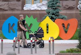 A serviceman with his wife and child