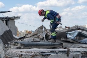 Rescuer dismantles debris in Kharkiv