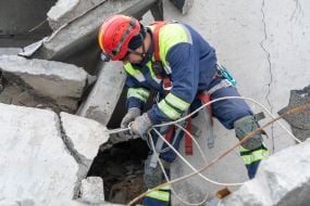Rescuer dismantles debris in Kharkiv