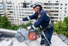 Rescuer dismantles debris in Kharkiv