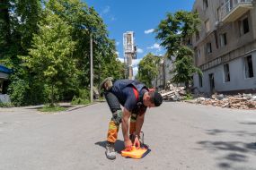 Rescuer near the destroyed house in Kharkiv