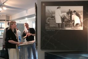 Svitlana Onyschuk inspects the exposition in the memorial complex "Demyaniv Laz"