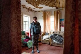 Raisa Sikriera is standing in her own dilapidated house in the village of Kuhari