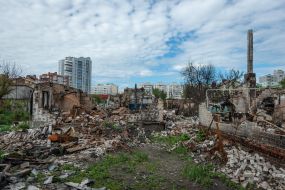 The remains of a downed Russian plane and the destruction it caused in the private sector of Chernihiv