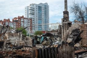 The remains of a downed Russian plane and the destruction it caused in the private sector of Chernihiv