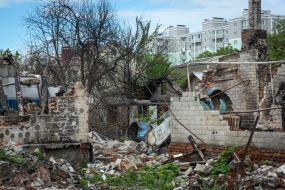The remains of a downed Russian plane and the destruction it caused in the private sector of Chernihiv