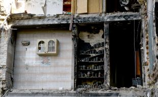 Surviving fragment of a room in a house in the village of Gorenka destroyed by shelling by Russian occupiers