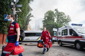 Ambulance doctors near the house where the rocket hit
