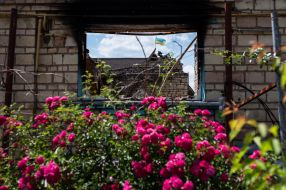 Flag of Ukraine on a damaged building in Moshchun village (Kyiv region)