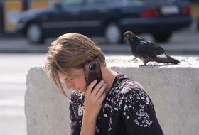 Pigeon near the girl