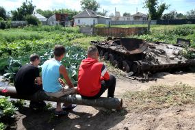 Cabbage around the destroyed tank of the Russian invaders in the vegetable garden in the village of Velyka Dymerka