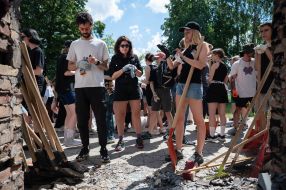 Volunteers clean up the rubble of the House of Culture in the village of Yagidne, Chernihiv region