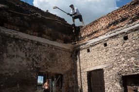 Volunteers clean up the rubble of the House of Culture in the village of Yagidne, Chernihiv region