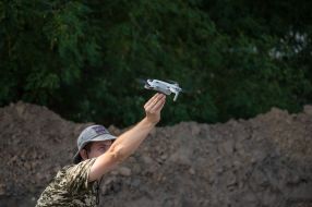 A military man with a drone