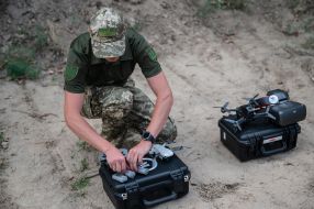A military man with a drone