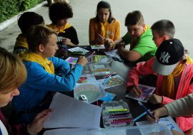 Children draw cards for Gorilla Tony