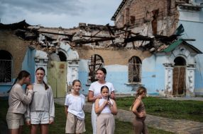 Children near the House of Culture in Irpіn, which was destroyed as a result of shelling by the Russian occupiers