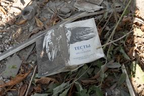 Textbook near the destroyed building of the educational institution