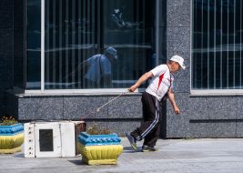 A man pulls a gas stove