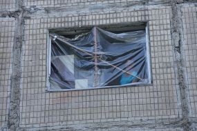 A window of a house damaged by Russian missiles