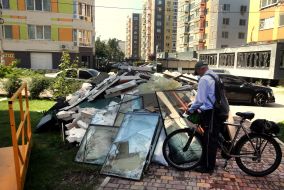 Broken double-glazed windows and fragments of building structures in Irpen