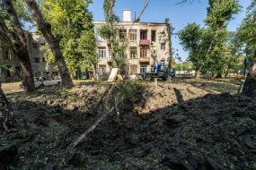 A crater after the shelling of the city by Russian invaders