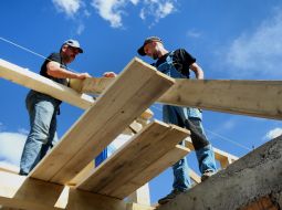 Volunteers of the Church of Christians participate in the restoration of a destroyed residential building in the city of Bucha