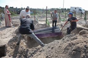 Burial of unidentified bodies of people who died and died during the occupation at the city cemetery in Bucha