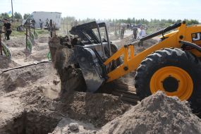 Burial of unidentified bodies of people who died and died during the occupation at the city cemetery in Bucha