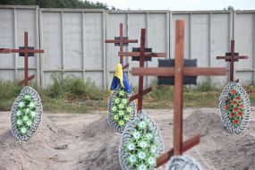 Burial of unidentified bodies of people who died and died during the occupation at the city cemetery in Bucha