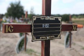 Burial of unidentified bodies of people who died and died during the occupation at the city cemetery in Bucha
