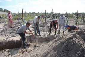 Burial of unidentified bodies of people who died and died during the occupation at the city cemetery in Bucha