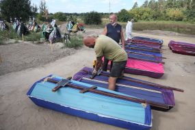 Burial of unidentified bodies of people who died and died during the occupation at the city cemetery in Bucha