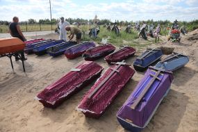 Burial of unidentified bodies of people who died and died during the occupation at the city cemetery in Bucha