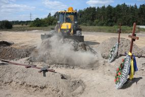 Burial of unidentified bodies of people who died and died during the occupation at the city cemetery in Bucha