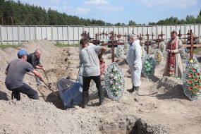 Burial of unidentified bodies of people who died and died during the occupation at the city cemetery in Bucha
