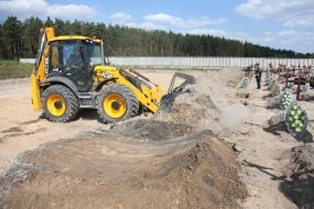 Burial of unidentified bodies of people who died and died during the occupation at the city cemetery in Bucha